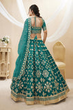 Art Silk Fabric Embroidered Sangeet Wear Designer Lehenga Choli In Teal Color.