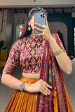 Art Silk Fabric Captivating Mustard Color Foil Printed Lehenga.
