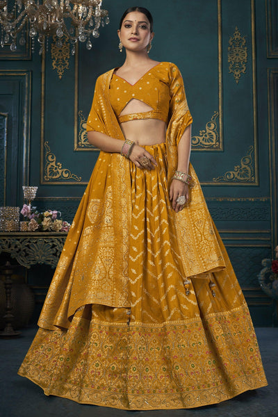 Wedding Wear Art Silk Fabric 3 Piece Lehenga Choli In Mustard Color.