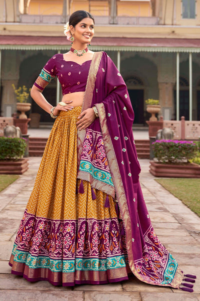 Art Silk Fabric Mustard Color Beatific Look Patola Style Foil Printed Lehenga.
