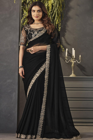 Smashing Black Color Lace Border Work Georgette Fabric Saree With Embroidered Blouse.