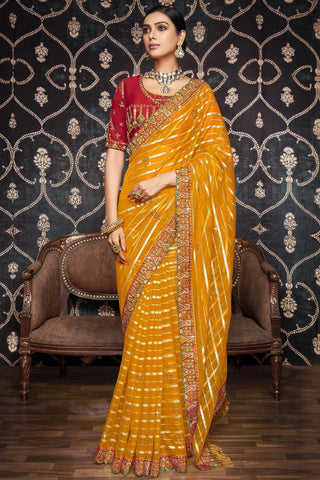 Radiant Border Work On Mustard Color Organza Fabric Saree.