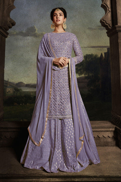 Sonal Chauhan Appealing Embroidered Work On Net Fabric Sharara Top Lehenga In Lavender Color.