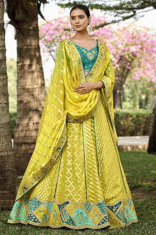 Banarasi Silk Fabric Yellow Color Patterned Lehenga With Jacquard Work.