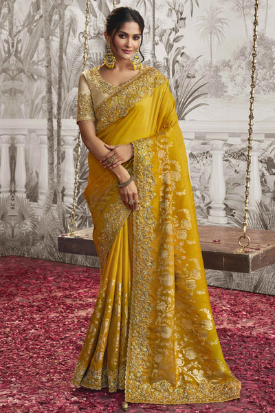 Appealing Heavy Embroidery Work Fancy Fabric Yellow Saree With Party Look Blouse.