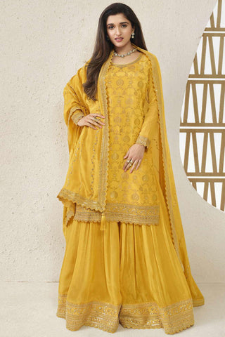 Nidhi Shah Sunshine Yellow Color Embroidered Palazzo Salwar Suit In Chinon Jacquard Fabric.
