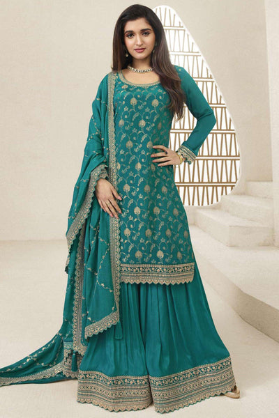 Nidhi Shah Teal Color Embroidered Palazzo Salwar Suit In Chinon Jacquard Fabric.
