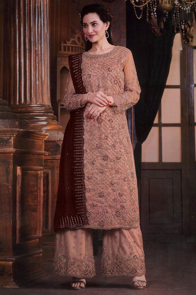 Alluring Net Fabric Peach Color Embroidered Palazzo Suit.