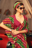 Embellished Maroon And Green Leheriya Printed Art Silk Saree.